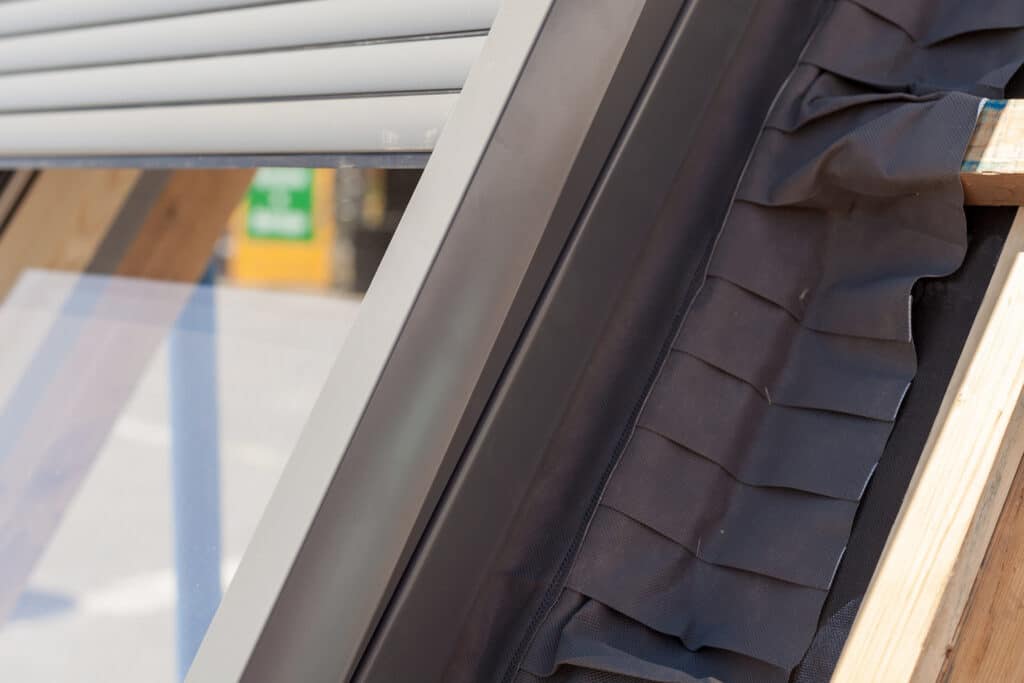 Closeup view of side parts with insulation and sponge seals of roof window (skylight or dormer)